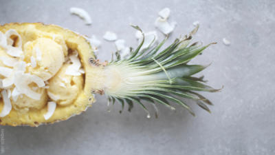coconut pineapple ice cream inside halved pineapple